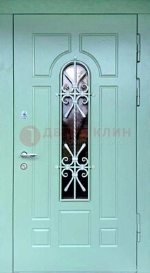 Светло-зеленая железная дверь со стеклом и ковкой ДСК-195 в Перми