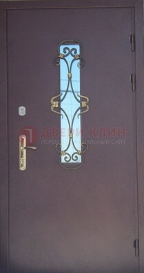 Металлическая дверь со стеклом и ковкой ДСК-77 в Перми